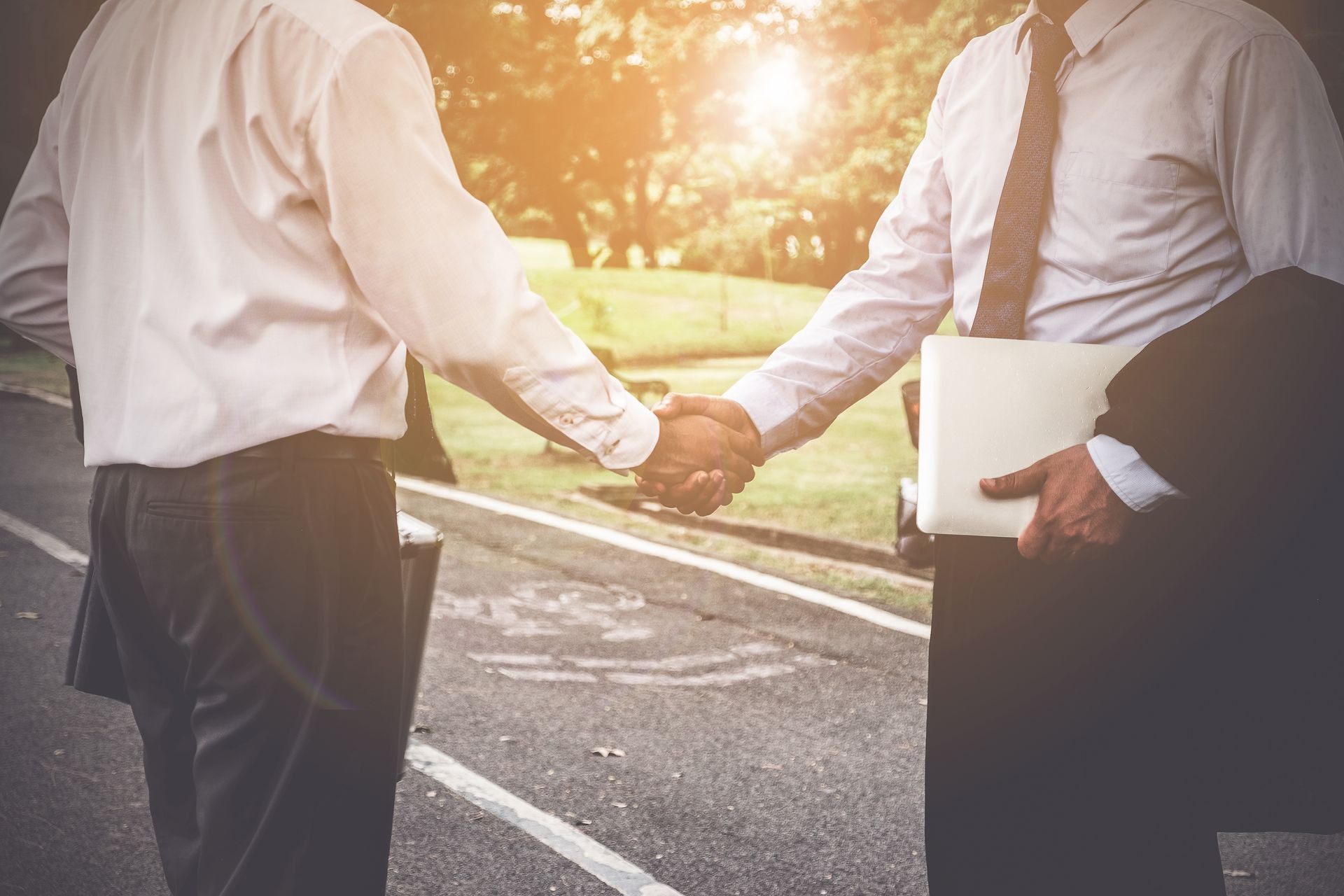 Business partnership meeting concept. Image of businessmans handshake. Successful businessmen handshaking after good deal or acquisition. Agency or Notary concept. 