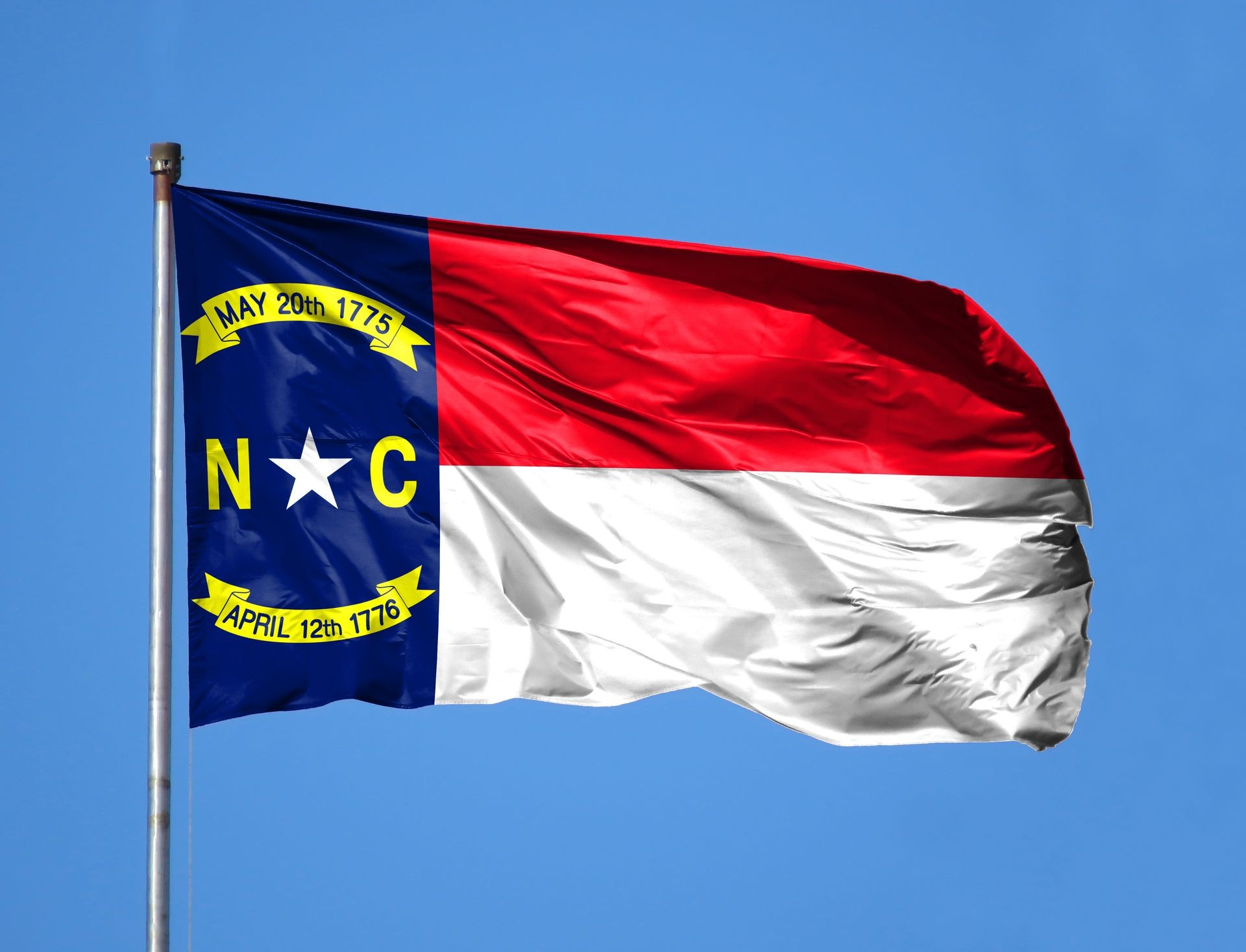 National flag State of North Carolina on a flagpole